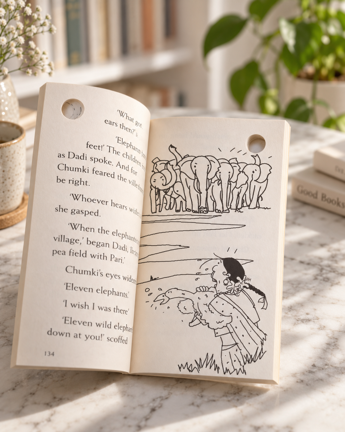 A Whole Lot of Chumki, open book showing elephants and Chumki