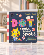 Dot Spots Lots of Spots, front cover of the board book with the spotted character Dot