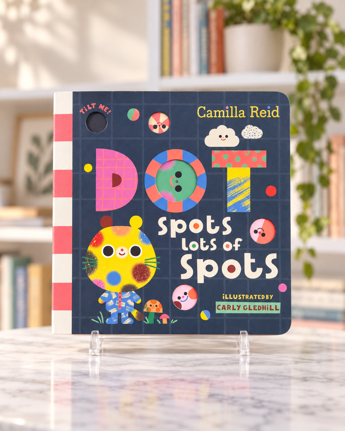 Dot Spots Lots of Spots, front cover of the board book with the spotted character Dot