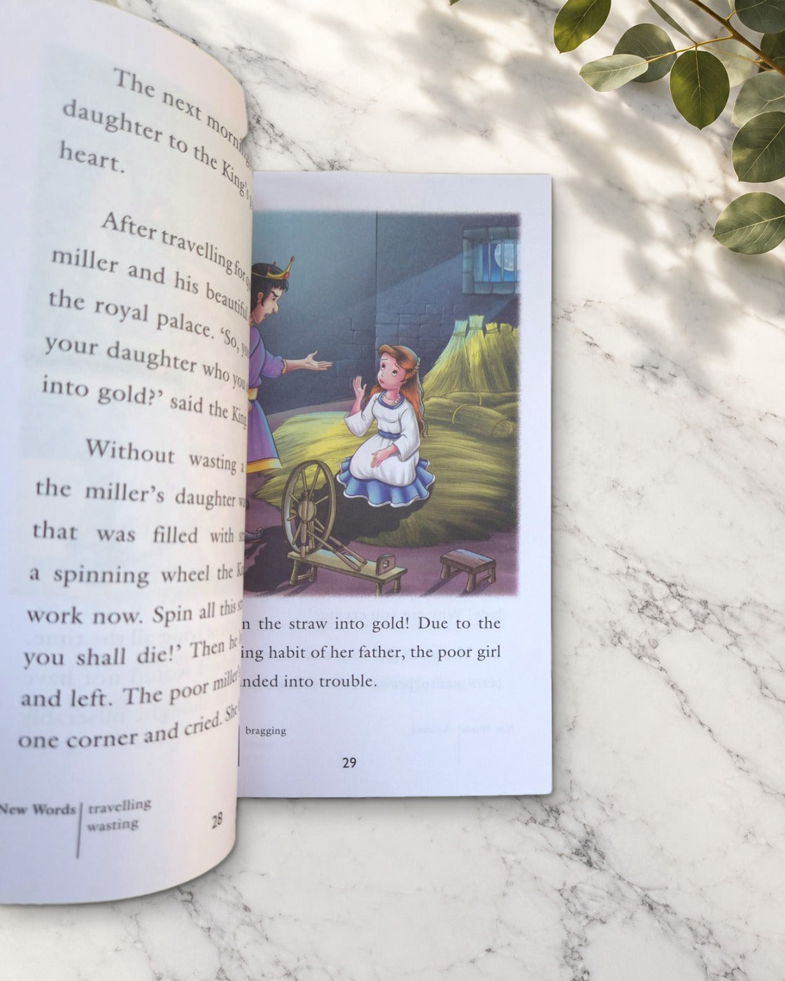Magical Stories, open book showing a girl at a spinning wheel