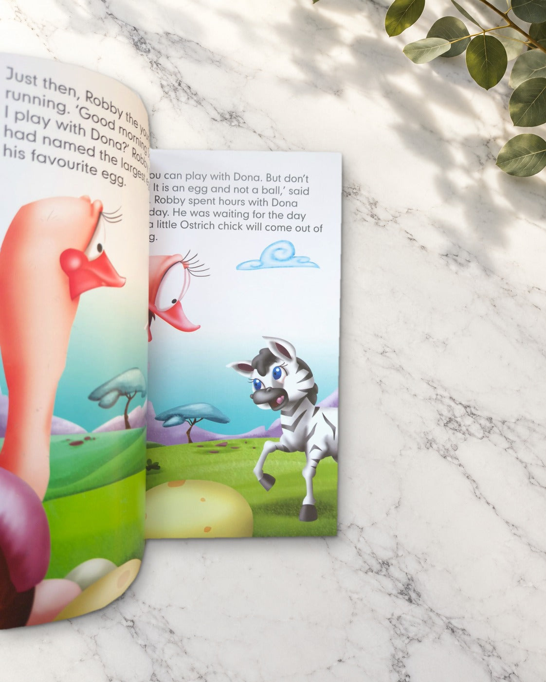 Once Upon a Time in Africa, open book showing an ostrich and a zebra
